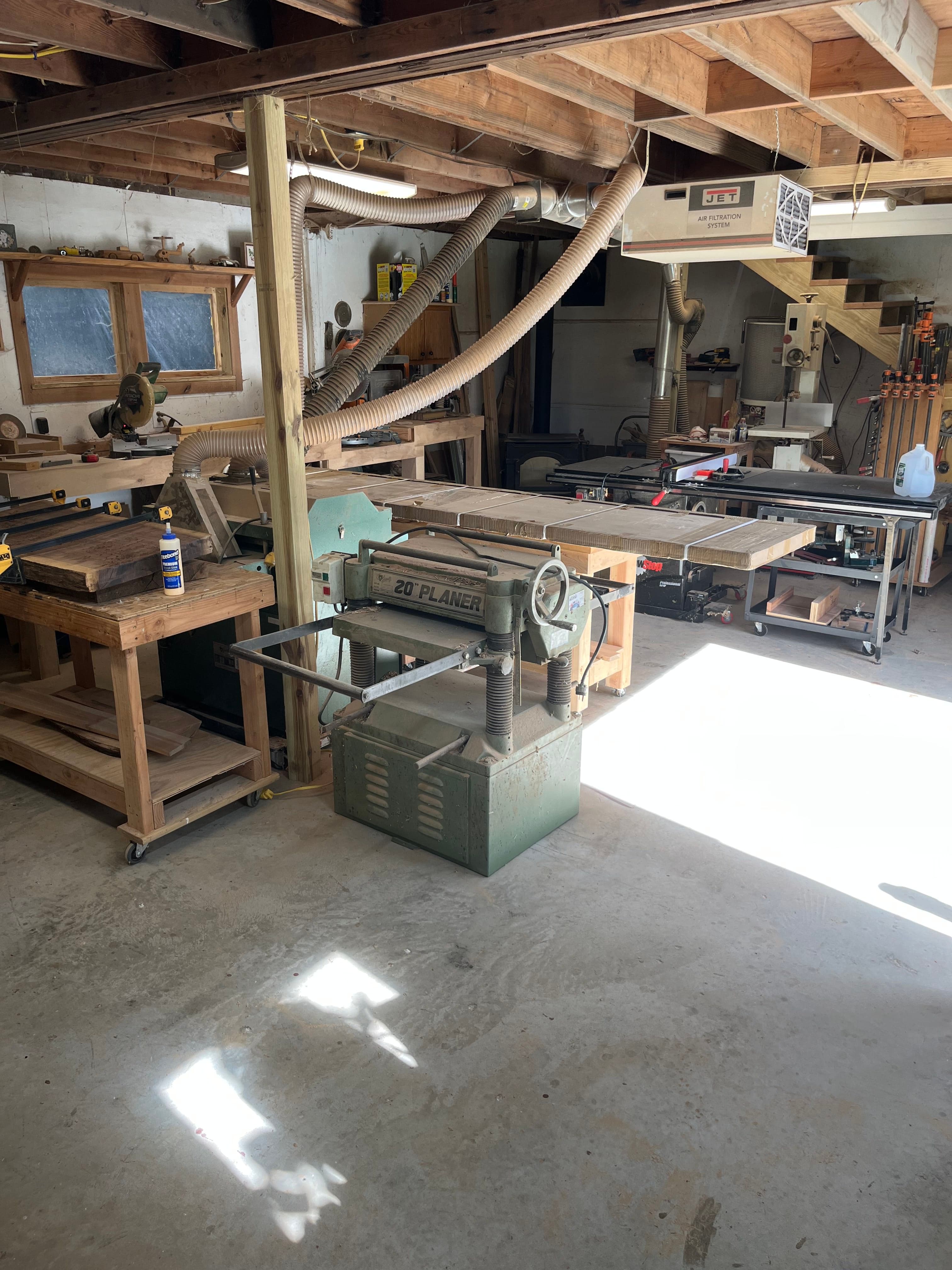 Woodworking shop interior with band saw and machinery